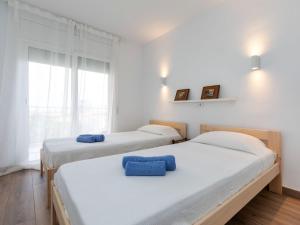 Ένα ή περισσότερα κρεβάτια σε δωμάτιο στο Apartment Albatros by Interhome