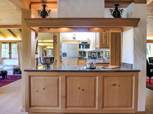 a large kitchen with a large island in a house at Holiday Home Chalet Rebhalde by Interhome in Schönried