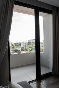 Un balcón o terraza de Excelente Depto en Las Lomas