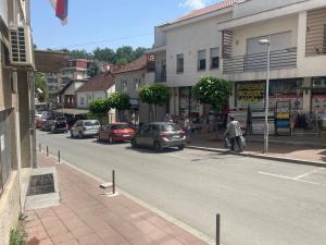 a street with cars parked on the side of the road at GoGo studio in Ljig