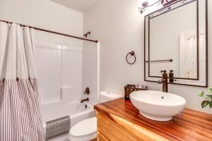 a bathroom with a white sink and a shower at Near Hiking Trails Overgaard Home with Large Yard! in Overgaard +16 photos