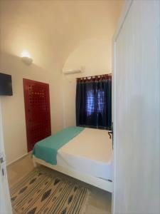 Postel nebo postele na pokoji v ubytování Hôtel Djerba Authentique - Au centre de Midoun