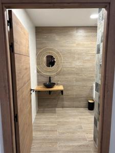 a bathroom with a sink and a mirror at Hostal Rural Sartaguda in Sartaguda +33 photos