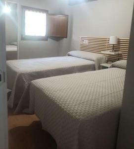 Ένα ή περισσότερα κρεβάτια σε δωμάτιο στο La Calzada del Canto