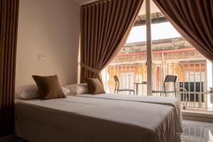 A bed or beds in a room at Maison S