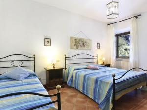 Ένα ή περισσότερα κρεβάτια σε δωμάτιο στο Apartment La Mangiatoia - TER104 by Interhome