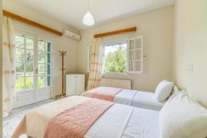 Postel nebo postele na pokoji v ubytování The Green Cottage 1