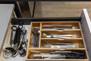 a drawer full of utensils in a kitchen at Warm getaway Perfect for 4 in Edmonton +8 photos