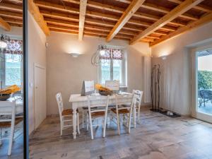 a dining room with a white table and chairs at Holiday Home Cascina-2 by Interhome in Costigliole dʼAsti