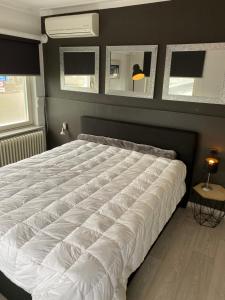 Ένα ή περισσότερα κρεβάτια σε δωμάτιο στο Appartement-woning Bellevue +10 φωτογραφίες