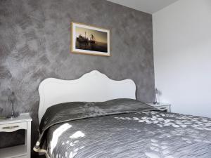 a bedroom with a bed and a picture on the wall at Villa Barbara Apartments in Sumartin +45 photos