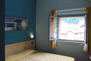 Ένα ή περισσότερα κρεβάτια σε δωμάτιο στο Lizard Hotel