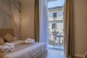 Postel nebo postele na pokoji v ubytování Maria Maruzzella B&B Luxury Suites