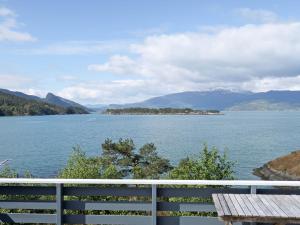 a view of a lake with mountains in the background at Holiday Home Blå Hytte by Interhome in Herand