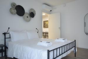 Katil atau katil-katil dalam bilik di Welc-ōM Padova Panta Rei rooms