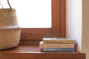 a stack of books sitting on top of a table at Casale in Val D Orcia in Sarteano