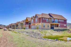 a row of houses on top of a hill at Hot Tub and Mtn Views Townhome in Granby! in Granby