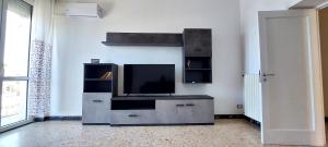 a living room with a flat screen tv on a entertainment center at CASA DI STEFANO in Gaeta