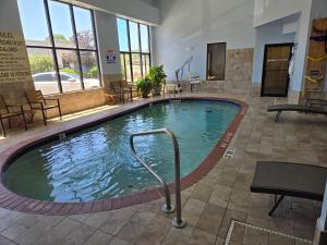 a large swimming pool in a hotel room at Holiday Inn Express Hotel & Suites Fenton/I-44 by IHG in Fenton
