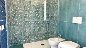 a bathroom with a toilet and a sink at SE104 - Elegante quadrilocale comodo ai servizi in Senigallia