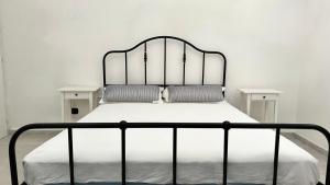 a white bed with two pillows on it at SE104 - Elegante quadrilocale comodo ai servizi in Senigallia