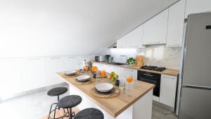 Kuchyň nebo kuchyňský kout v ubytování Apartments Tanya