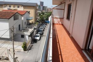 a view of a street from the balcony of a building at Crew Hostel Tirana in Tirana