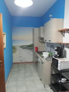 Kuchyň nebo kuchyňský kout v ubytování Appartamento da Simone a Rosolina Mare