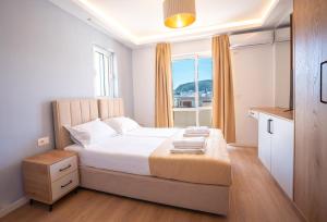 Postel nebo postele na pokoji v ubytování Illyria Hotel