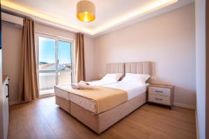 Illyria Hotel客房内的一张或多张床位