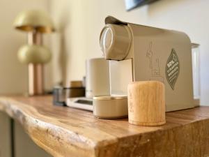 a toaster sitting on top of a wooden counter at Anno13Suites in Naples