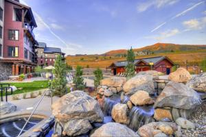 a water feature in a yard with rocks at Yampa Valley Escape in Steamboat Springs
