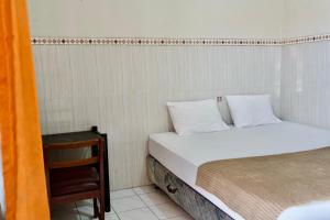 Letto o letti in una camera di Garuda Setia Hotel