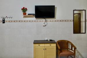 TV o dispositivi per l'intrattenimento presso Garuda Setia Hotel