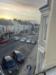 a view of a city street with parked cars at 3 Bed Flat - Sleeps 6 - Parking - Wifi in Antrim