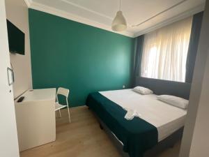 Postel nebo postele na pokoji v ubytování KHAN's B&B HOTEL