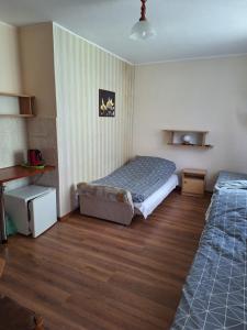 Postel nebo postele na pokoji v ubytování pokoje STIFADO