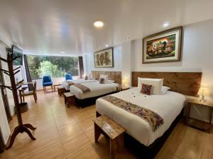 Voodi või voodid majutusasutuse Hotel Tara Machupicchu toas