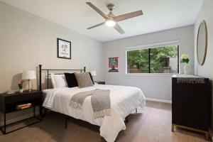a bedroom with a bed and a ceiling fan at Charming South Austin 2 Bedroom Home in Austin