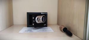 a microwave oven sitting on a counter with a paper at Arianna Apartman in Miskolc