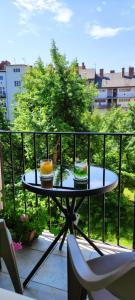 two cakes sitting on a table on a balcony at Arianna Apartman in Miskolc +31 photos