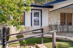 a house with a porch with a table and chairs at Waterlily Creekside Serenity in Wimberley