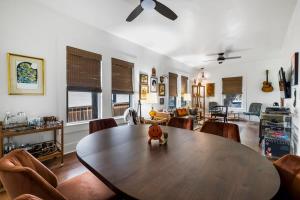 a living room with a wooden table and chairs at Retro Austin Home S Congress Ave in Austin
