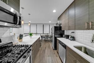a kitchen with a stove and a sink at Avenue A821 I Cozy And Comfy Philadelphia Stay in Philadelphia