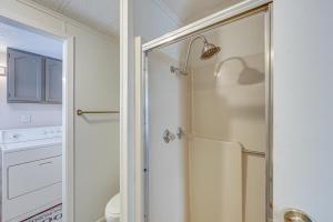 a shower with a glass door in a bathroom at Lakefront Gun Barrel City Home with Dock and Deck in Gun Barrel City +32 photos