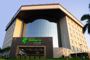 a building with a hilton tumkur hotel at Holiday Inn San Salvador, an IHG Hotel in San Salvador