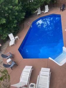 an overhead view of a swimming pool with chairs at Virginia Beach 2Story with Pool in Virginia Beach