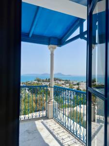 a view of the ocean from a balcony at La Menara Hotel & SPA in Sidi Bou Saïd