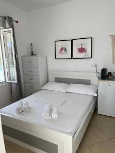 Postel nebo postele na pokoji v ubytování Spile Rooms Lukas