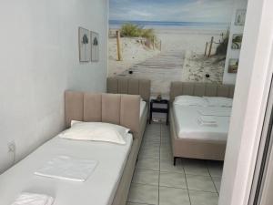 Postel nebo postele na pokoji v ubytování Spile Rooms Lukas